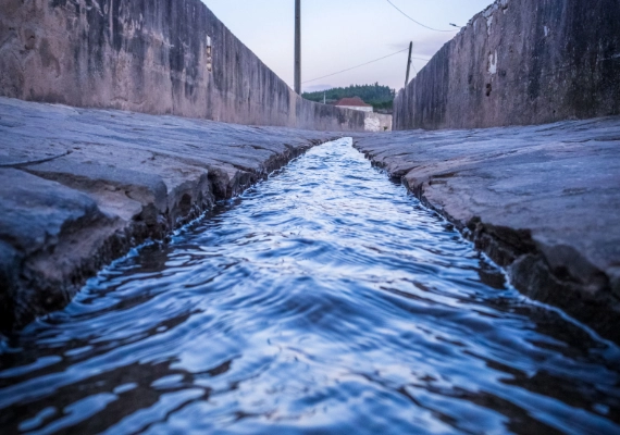 Water flowing through a concrete canal for industrial or drainage applications